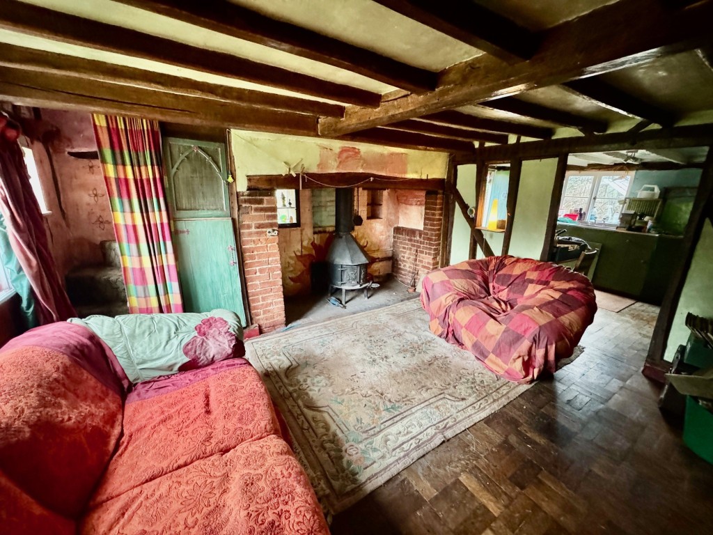 Lot: 31 - DETACHED PERIOD COTTAGE AND ORCHARD LAND - Living room with Inglenook fireplace